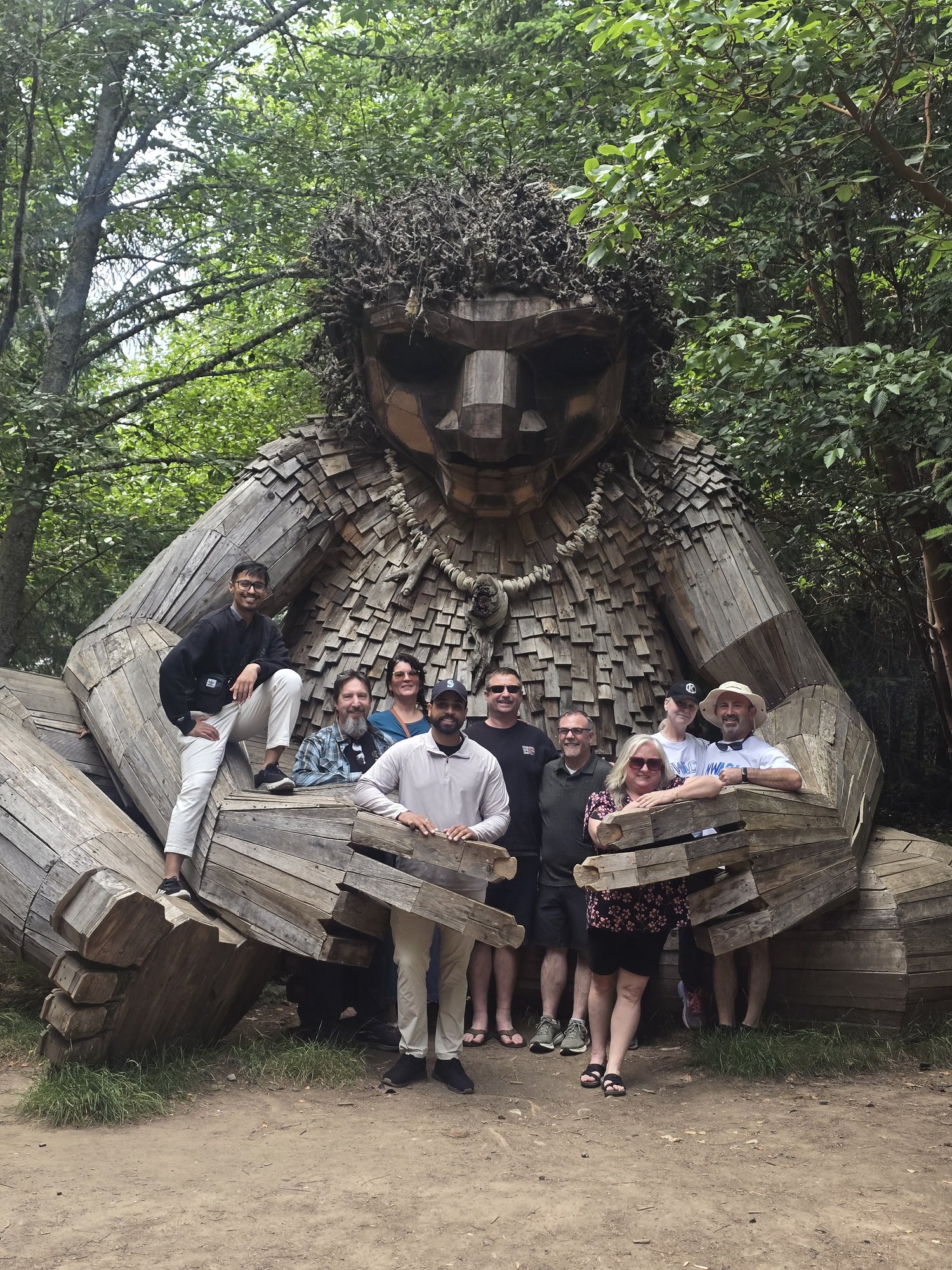 A handful of us with the wooden troll on Bainbridge Island