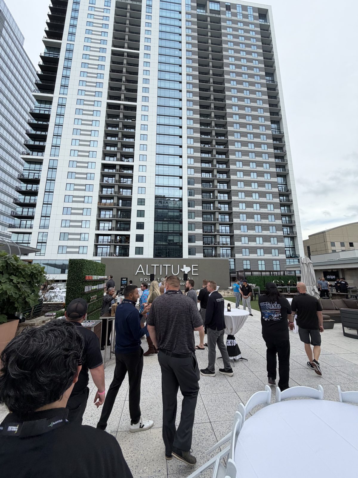 Shops networking at the ALTITUDE rooftop event during Tektonic 2026